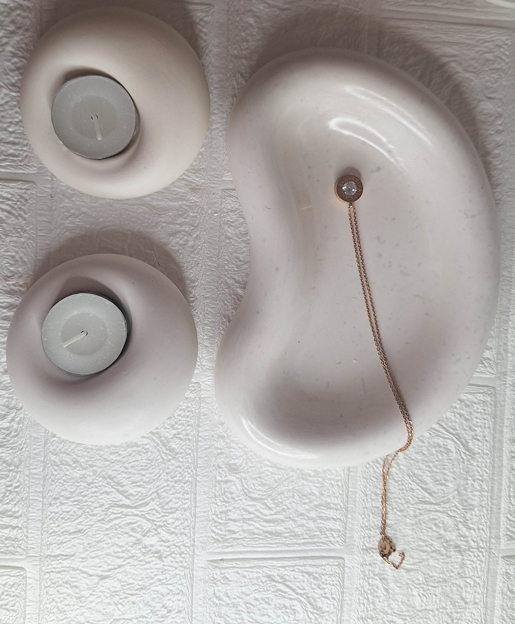 Cloud & Glow Resin Set - top view of two donut tealight holders and organic dish with necklace